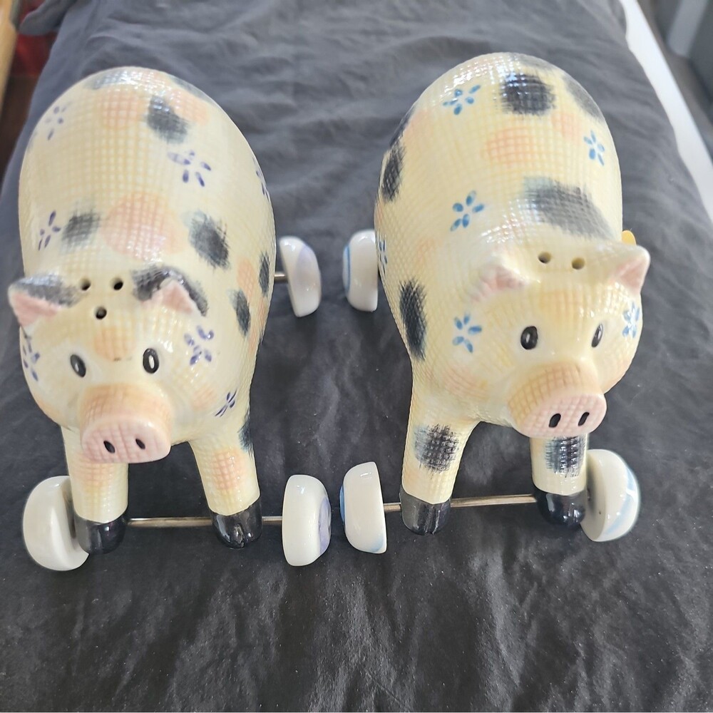 unique  ￼Pigs On Wheels ￼ made of porcelain Salt and Pepper Shakers